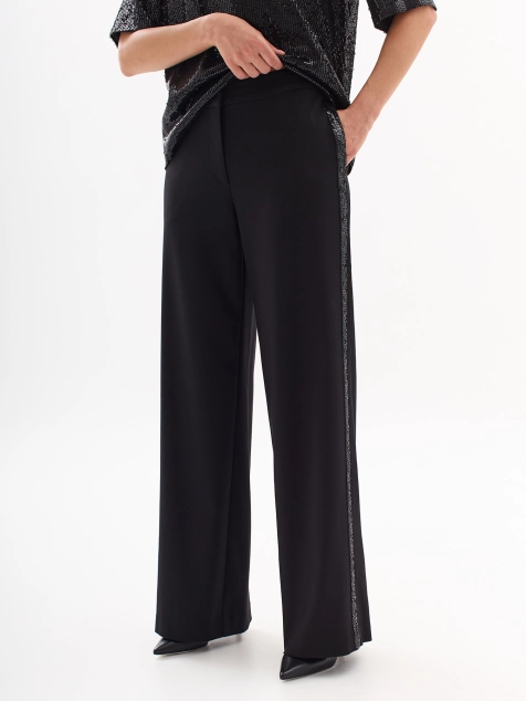 Брюки свободного силуэта с яркими лампасами из пайеток