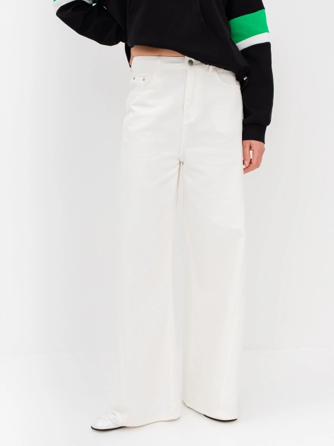 Джинсы из 100% хлопка расширенные к низу