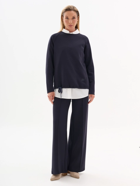 Трикотажные брюки с минималистичной вышивкой