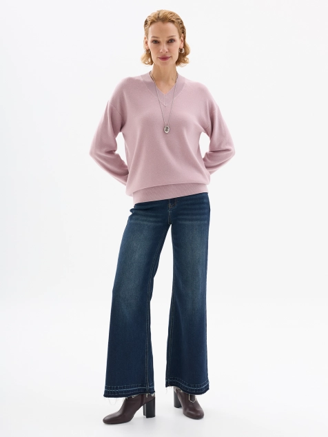 Джинсы клеш с декором по низу