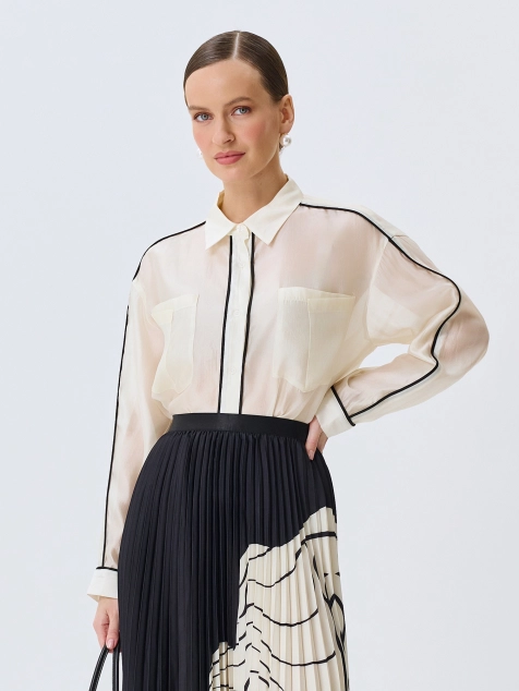 Полупрозрачная блузка с контрастными кантами