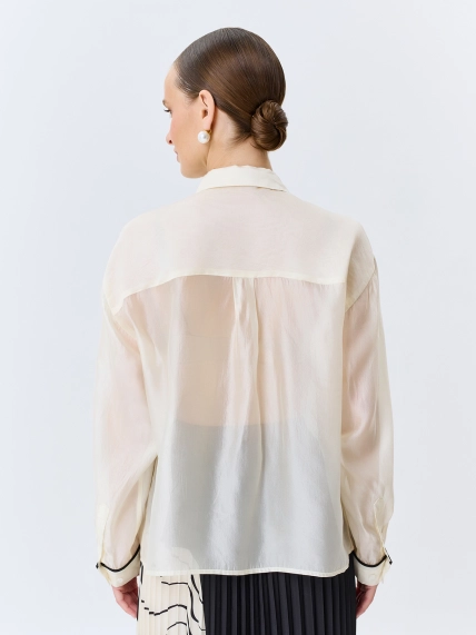 Полупрозрачная блузка с контрастными кантами